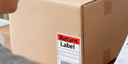 Cardboard box with a return label attached