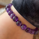 EEBracelet Amethyst on a wrist with a blurred background
