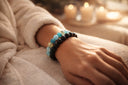 Close-up of a female wrist wearing  BlackOnyx and LapisLazuli  two beaded bracelets 