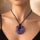 EEMedallion Amethyst purple circular pendant worn on black cord
