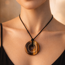 EEMedallion Golden Tiger with a wooden circular pendant on black cord