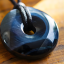 EEMedallion Hawk Eye on a wooden surface.