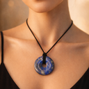 EEMedallion Lapis Lazuli circular pendant necklace worn on a black cord 