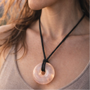 EEMedallion Rose Quartz worn by a person.
