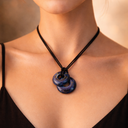 EEMedallion Twin Hawkeye has a 2 small circular blue pendant on black cord