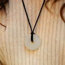 EEMedallion White Jade on a textured beige background