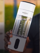 Person holding EESystem Hydrogen Water Bottle